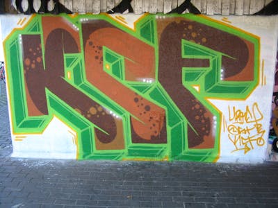 Light Green and Brown Stylewriting by Pear, OST and KCF. This Graffiti is located in Delitzsch, Germany and was created in 2008. This Graffiti can be described as Stylewriting and Wall of Fame.