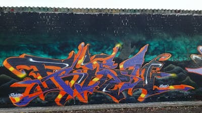 Orange and Cyan and Violet Stylewriting by Dekster and 18K crew. This Graffiti is located in Berlin, Germany and was created in 2023.