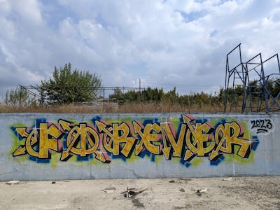 Yellow and Colorful Stylewriting by Forever. This Graffiti is located in Albania and was created in 2023. This Graffiti can be described as Stylewriting and Abandoned.