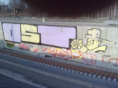 Yellow and Violet and Black Characters by urine, mobar, kafor, Jolly Fellow, OST and Pizar. This Graffiti is located in Leipzig, Germany and was created in 2010. This Graffiti can be described as Characters, Roll Up and Line Bombing.
