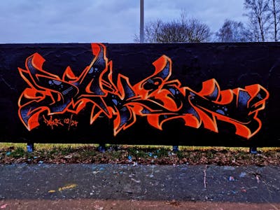 Black and Orange Stylewriting by Deki and AF-Crew. This Graffiti is located in Wolfenbüttel, Germany and was created in 2024. This Graffiti can be described as Stylewriting and Wall of Fame.