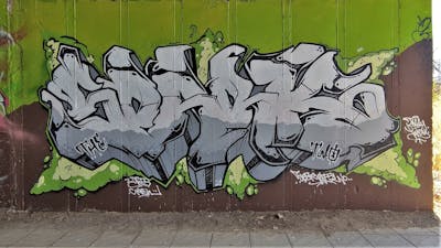 Grey and Light Green and Brown Stylewriting by SparkTwo and LFT. This Graffiti is located in Agrinio, Greece and was created in 2021.