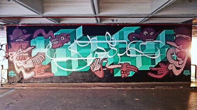 Cyan and Coralle Stylewriting by Hülpman, urine, OST and PÜTK. This Graffiti is located in Athen, Greece and was created in 2020. This Graffiti can be described as Stylewriting, Characters, Futuristic, Streetart and Handstyles.
