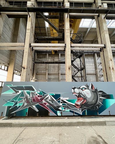 Grey and Cyan Stylewriting by Tokk and Pork. This Graffiti is located in Germany and was created in 2022. This Graffiti can be described as Stylewriting, Characters, Abandoned and Murals.