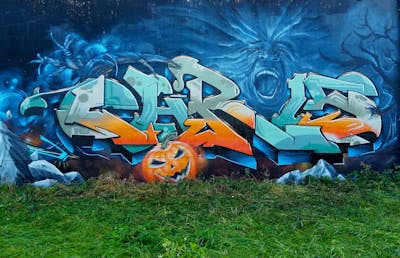 Blue and Cyan and Orange Stylewriting by Chr15. This Graffiti is located in Delitzsch, Germany and was created in 2023. This Graffiti can be described as Stylewriting, Characters and Abandoned.