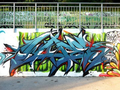 Cyan and Colorful Stylewriting by Wuper. This Graffiti is located in Kraljevo, Serbia and was created in 2014. This Graffiti can be described as Stylewriting.