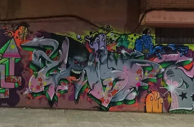 Colorful Characters by TCK and Gonso13. This Graffiti is located in madrid, Spain and was created in 2021. This Graffiti can be described as Characters and Stylewriting.