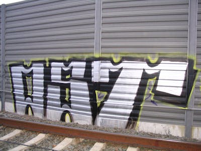 Chrome and Black Stylewriting by urine and OST. This Graffiti is located in Bitterfeld, Germany and was created in 2008. This Graffiti can be described as Stylewriting and Line Bombing.