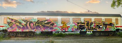 Colorful Stylewriting by Riots and azlak. This Graffiti is located in Jena, Germany and was created in 2022. This Graffiti can be described as Stylewriting, Trains, Characters, Wall of Fame and Freights.