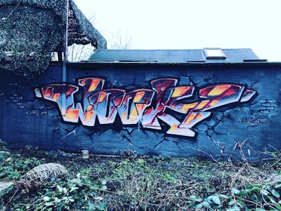 Grey and Orange Stylewriting by WOOKY. This Graffiti is located in Leipzig, Germany and was created in 2022.