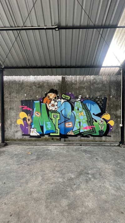 Colorful Stylewriting by Minas. This Graffiti is located in Yogyakarta, Indonesia and was created in 2022. This Graffiti can be described as Stylewriting, Characters and Abandoned.