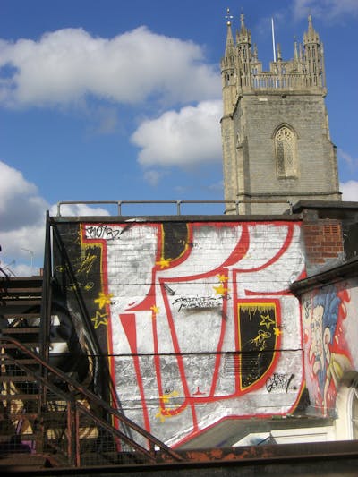 Chrome and Red Street Bombing by Riots. This Graffiti is located in Cardiff, United Kingdom and was created in 2009. This Graffiti can be described as Street Bombing and Atmosphere.