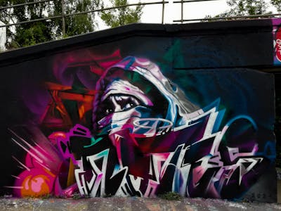 Colorful Stylewriting by Notes. This Graffiti is located in Prague, Czech Republic and was created in 2021. This Graffiti can be described as Stylewriting, Characters and Wall of Fame.