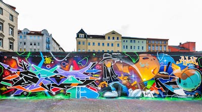 Colorful Stylewriting by Spot 189 and More 189. This Graffiti is located in HALLE, Germany and was created in 2022. This Graffiti can be described as Stylewriting, Characters and Wall of Fame.