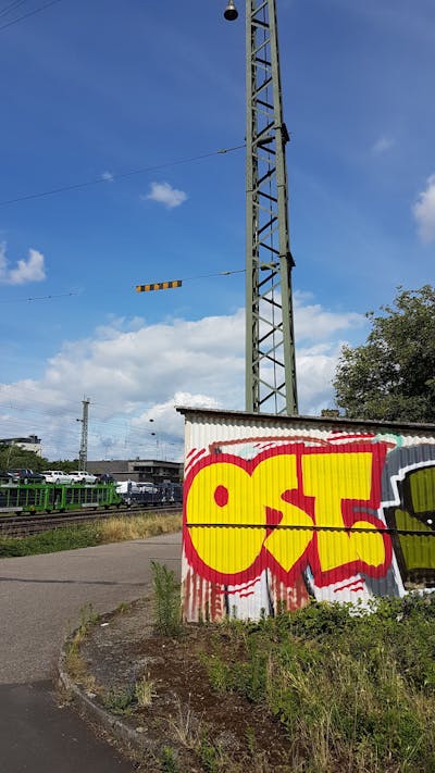 Red and Yellow Stylewriting by urine and OST. This Graffiti is located in Wiesbaden, Germany and was created in 2018. This Graffiti can be described as Stylewriting and Street Bombing.