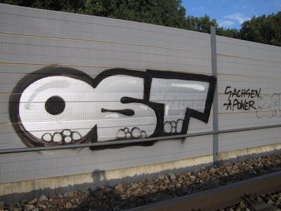 Chrome and Black Stylewriting by urine, OST and Pizar. This Graffiti is located in Ingolstadt, Germany and was created in 2011. This Graffiti can be described as Stylewriting and Line Bombing.