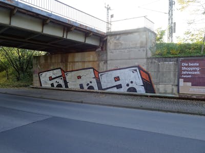 Chrome and Black and Orange Stylewriting by 689 and 689ers. This Graffiti is located in coswig, Germany and was created in 2022. This Graffiti can be described as Stylewriting and Street Bombing.