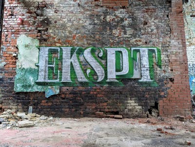 White and Light Green Stylewriting by Eksept. This Graffiti is located in Canada and was created in 2024. This Graffiti can be described as Stylewriting, Abandoned and Atmosphere.