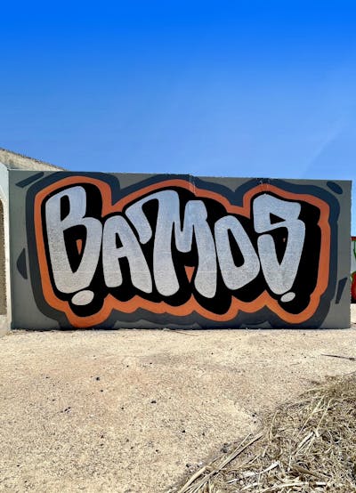 Black and Chrome and Orange Stylewriting by Bamos. This Graffiti is located in Valencia, Spain and was created in 2023.