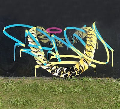 Beige and Yellow and Cyan Characters by Paconer. This Graffiti is located in LISBON, Portugal and was created in 2023. This Graffiti can be described as Characters, Handstyles and Streetart.