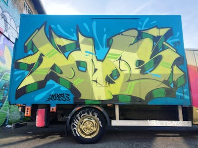 Light Green Stylewriting by Royes. This Graffiti is located in copenhagen, Denmark and was created in 2024. This Graffiti can be described as Stylewriting and Cars.