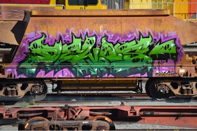 Violet and Green Stylewriting by DEVOS. This Graffiti is located in Australia and was created in 2022. This Graffiti can be described as Stylewriting, Trains and Freights.