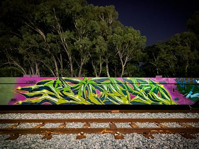 Coralle and Light Green and Blue Stylewriting by Bancks. This Graffiti is located in Perth, Australia and was created in 2023. This Graffiti can be described as Stylewriting and Line Bombing.