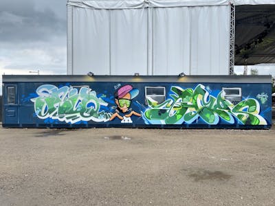 Green and Blue Stylewriting by UNIQ and Hmas. This Graffiti is located in Splash Festival, Germany and was created in 2022. This Graffiti can be described as Stylewriting and Characters.