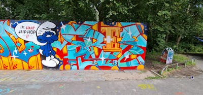 Orange and Light Blue Stylewriting by Srek. This Graffiti is located in The Hague, Netherlands and was created in 2021. This Graffiti can be described as Stylewriting and Characters.