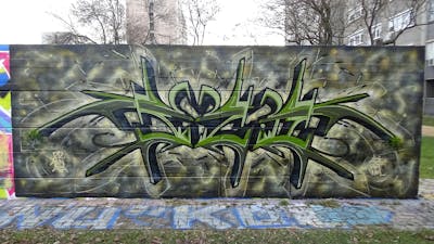 Green Wall of Fame by Fuzio. This Graffiti is located in Szolnok, Hungary and was created in 2022. This Graffiti can be described as Wall of Fame and Stylewriting.