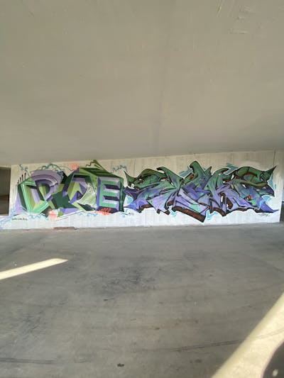 Violet and Light Green Stylewriting by Sloke and DKAY. This Graffiti is located in Thailand and was created in 2023.