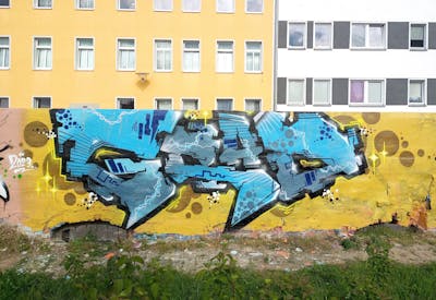 Beige and Light Blue and Grey Stylewriting by GRAD. This Graffiti is located in Halle/Saale, Germany and was created in 2023.