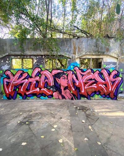 Coralle and Red and Violet Stylewriting by Kidney. This Graffiti is located in Bali, Indonesia and was created in 2023. This Graffiti can be described as Stylewriting, Characters and Abandoned.
