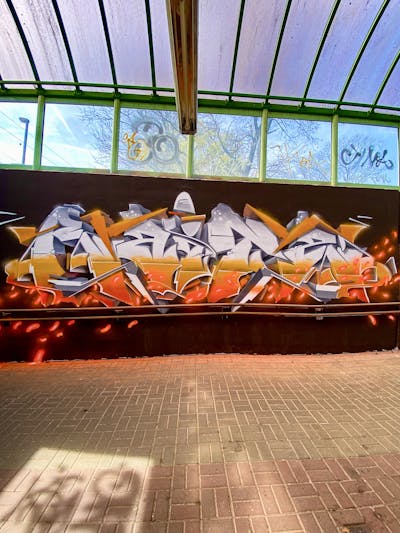 Orange and White and Grey Stylewriting by Raitz. This Graffiti is located in Germany and was created in 2023.
