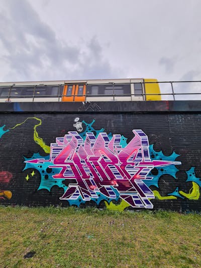 Violet and Cyan and Colorful Stylewriting by Shibe. This Graffiti is located in London, United Kingdom and was created in 2023.