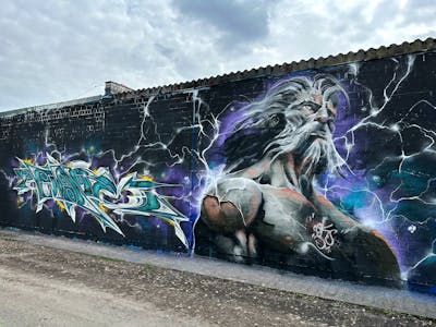 Cyan and Grey and Colorful Wall of Fame by Cors One and Wave Nine. This Graffiti is located in Berlin, Germany and was created in 2023. This Graffiti can be described as Wall of Fame, Stylewriting and Characters.