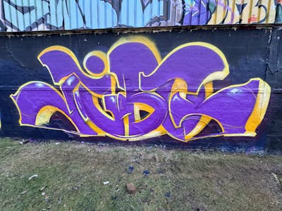 Violet and Yellow Stylewriting by Jibo and MDS. This Graffiti is located in Düsseldorf, Germany and was created in 2023. This Graffiti can be described as Stylewriting and Wall of Fame.