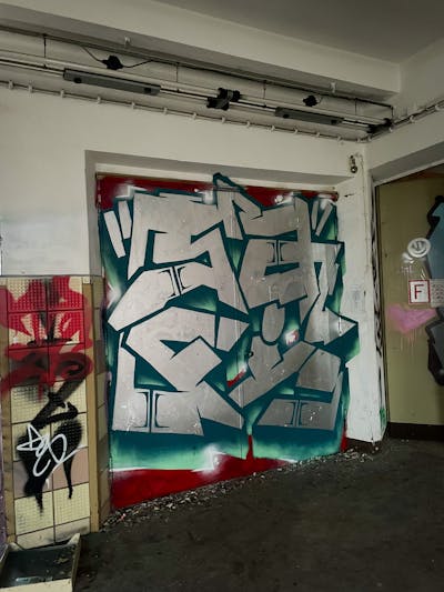 Chrome and Cyan and Red Stylewriting by Safi. This Graffiti is located in Döbeln, Germany and was created in 2023. This Graffiti can be described as Stylewriting and Abandoned.