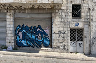 Blue and Light Blue Stylewriting by Stier. This Graffiti is located in Jordan and was created in 2022. This Graffiti can be described as Stylewriting and Street Bombing.