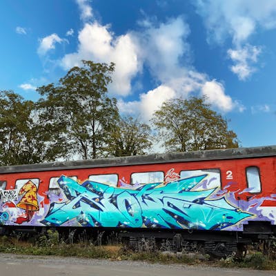 Cyan and Red Stylewriting by Riots. This Graffiti is located in Jena, Germany and was created in 2022. This Graffiti can be described as Stylewriting and Wall of Fame.