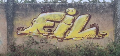 Yellow and Brown Stylewriting by fil, urbansoldierz, graffdinamics and mtrclan. This Graffiti is located in Lleida, Spain and was created in 2023.