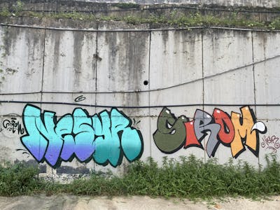 Colorful Stylewriting by Sirom and Nesyr. This Graffiti is located in Kuala Lumpur, Malaysia and was created in 2022. This Graffiti can be described as Stylewriting, Throw Up and Characters.