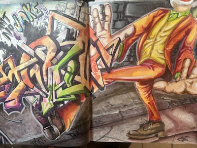 Colorful and Orange Blackbook by XQIZIT. This Graffiti is located in Jamaica Queens, United States and was created in 2024. This Graffiti can be described as Blackbook.