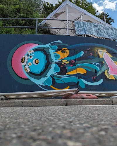 Cyan and Colorful Characters by Cami_ffc. This Graffiti is located in Ingolstadt, Germany and was created in 2023. This Graffiti can be described as Characters and Streetart.