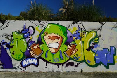 Light Green and Colorful Stylewriting by Aion. This Graffiti is located in Porto, Portugal and was created in 2021. This Graffiti can be described as Stylewriting and Characters.