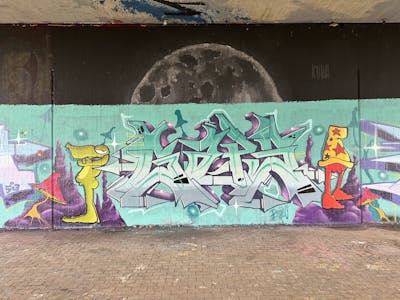Cyan and Violet and Colorful Stylewriting by Gaps. This Graffiti is located in Leipzig, Germany and was created in 2023. This Graffiti can be described as Stylewriting, Characters and Wall of Fame.