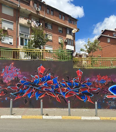Red and Blue and Orange Stylewriting by Heny. This Graffiti is located in pristina, Serbia and was created in 2023. This Graffiti can be described as Stylewriting and Wall of Fame.
