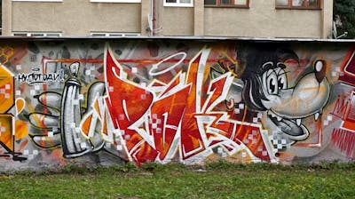 Red and Colorful Stylewriting by Notes. This Graffiti is located in Prague, Czech Republic and was created in 2021. This Graffiti can be described as Stylewriting, Characters and Wall of Fame.