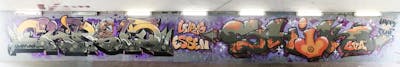 Orange and Grey and Violet Stylewriting by shik and Chr15. This Graffiti is located in Essen, Germany and was created in 2023. This Graffiti can be described as Stylewriting, Wall of Fame and Characters.
