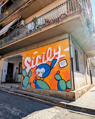 Orange and Colorful Characters by Octofly Art. This Graffiti is located in Acquedolci, Italy and was created in 2023. This Graffiti can be described as Characters and Streetart.